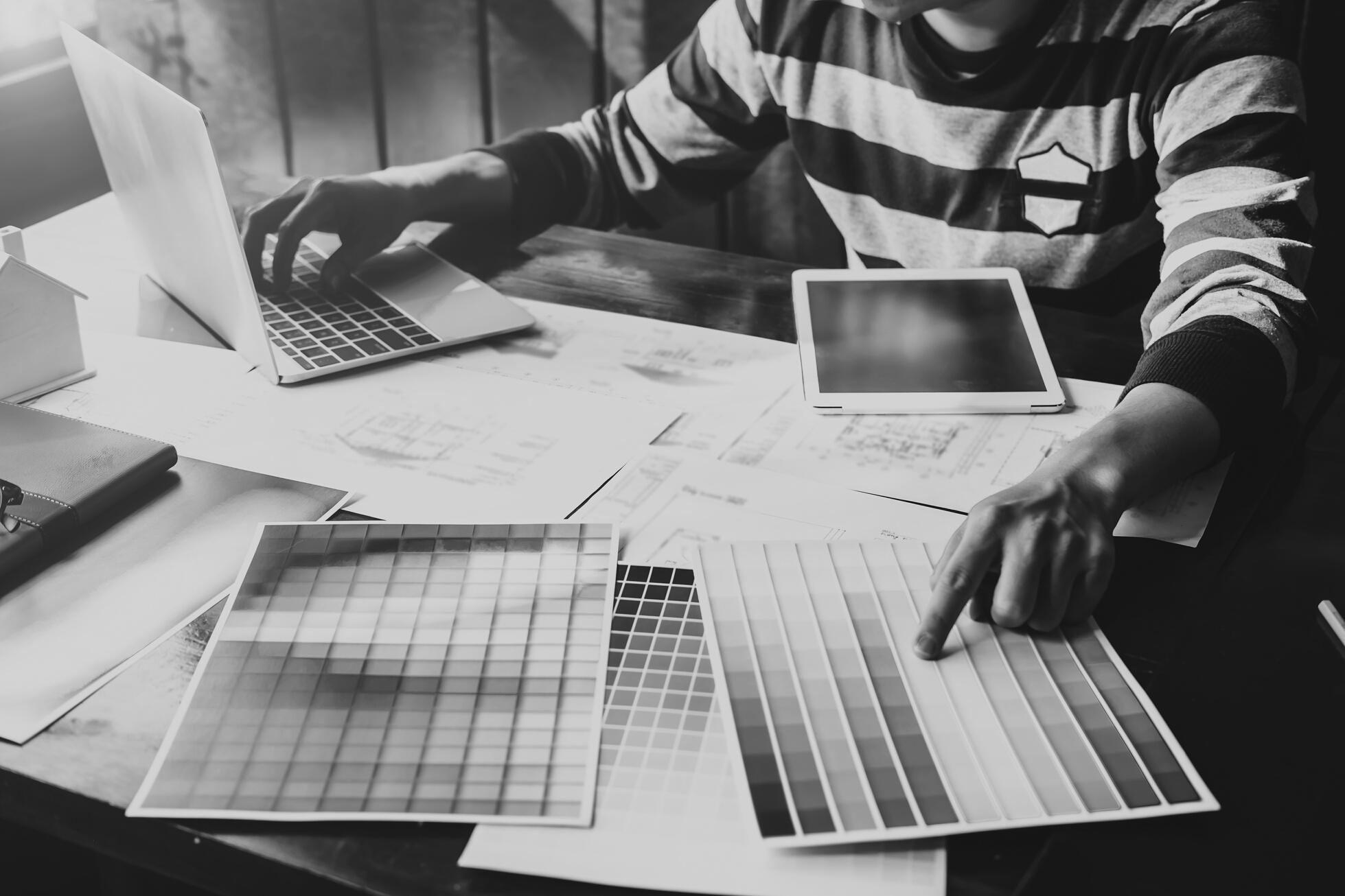 Graphic Designer Choosing Color While Typing on Laptop